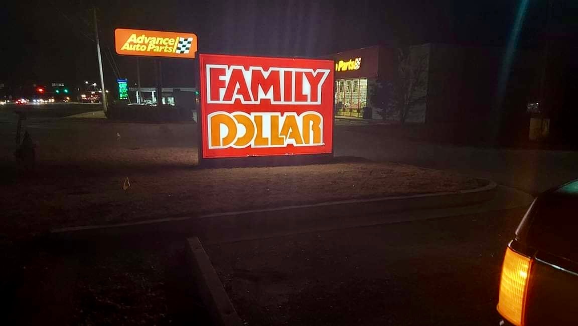 Family Dollar LED retrofit on embossed panformed sign in aluminum ground monument at night