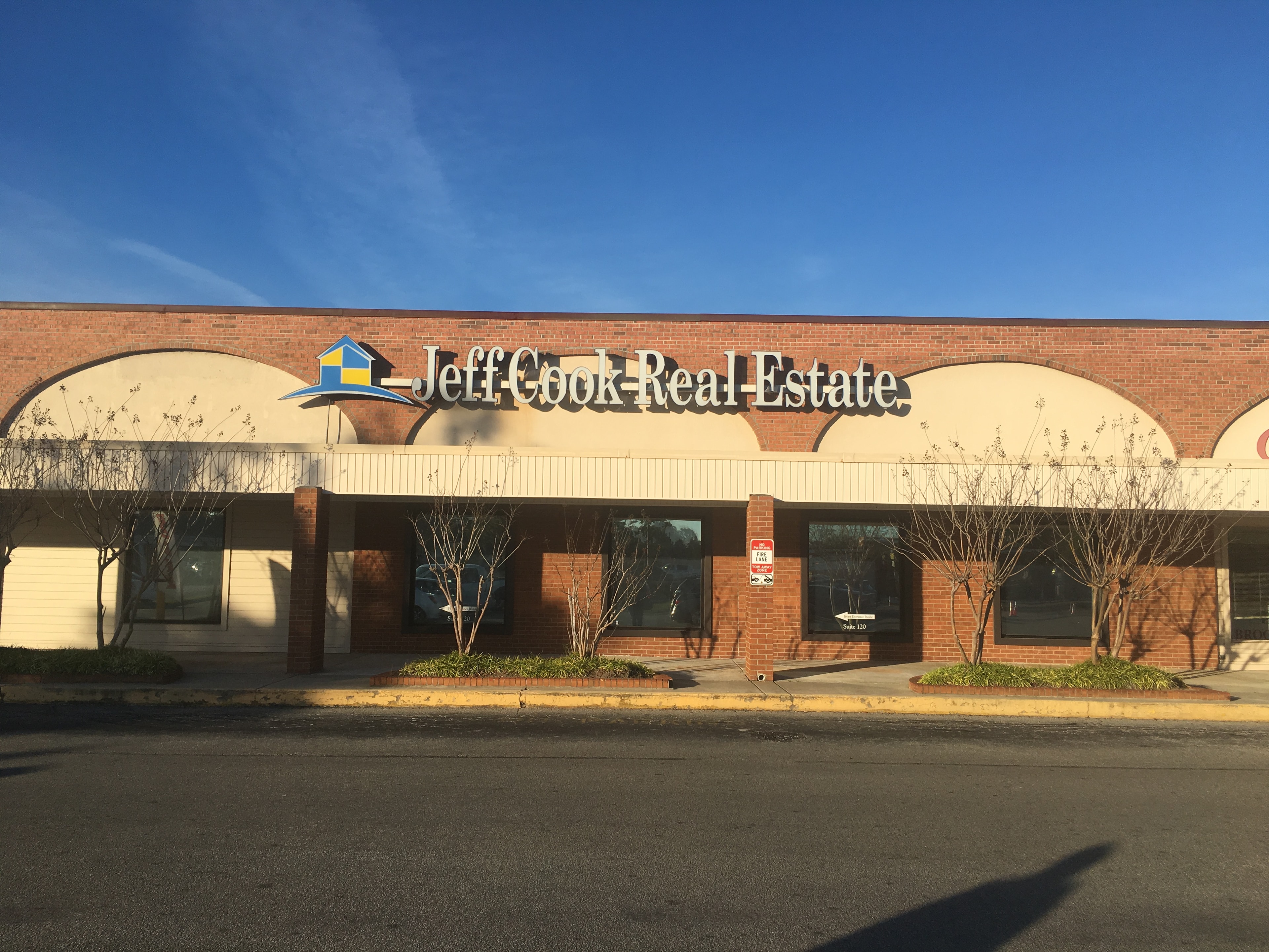 Jeff Cook Real Estate brick storefront sign installed by SOC