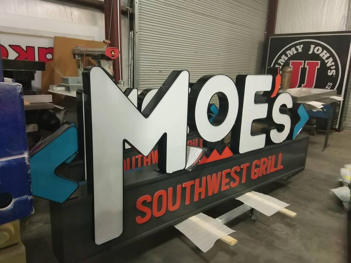 Moe's Southwest Grill sign in SOC warehouse ready for delivery